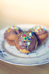 Homemade sweet tasty muffins with colourful decoration