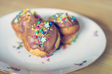 Homemade sweet tasty muffins with colourful decoration