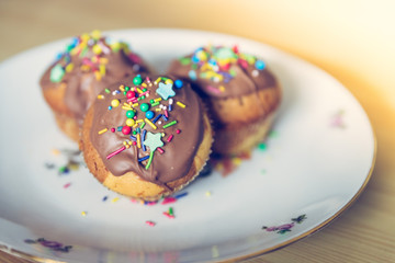 Homemade sweet tasty muffins with colourful decoration