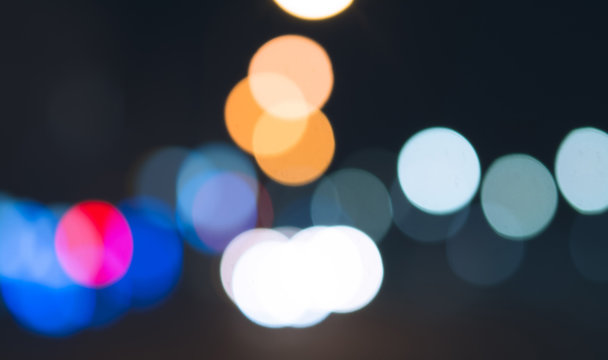 Night city bokeh light abstract background, blurred blue flare lens
