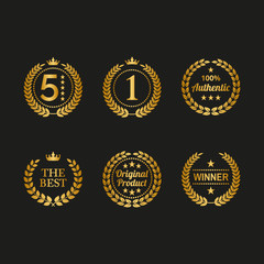 Set of golden laurel wreaths on black background.