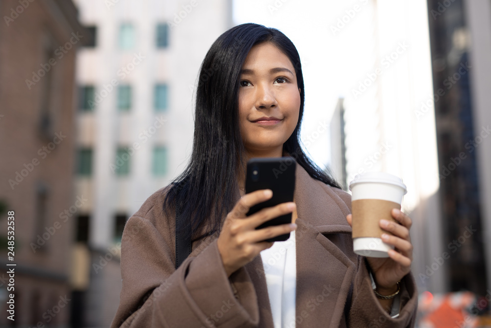 Canvas Prints Young Asian woman in city