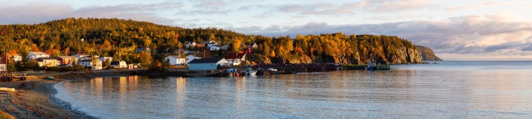 Small town on the Atlantic Ocean Coast during a vibrant sunrise. Taken in Beachside, Newfoundland, Canada.