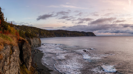Fototapeta premium Striking panoramic landscape view of a rocky Atlantic Ocean Coast during a vibrant sunrise. Taken at Beachside, Newfoundland and Labrador, Canada.