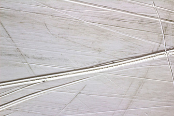 scratches on the sliding surface of the snowboard close-up