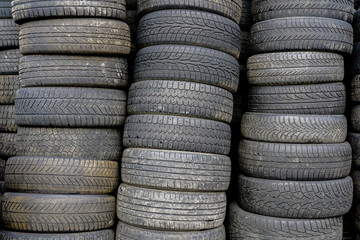 old used car tyres, stacked at car service