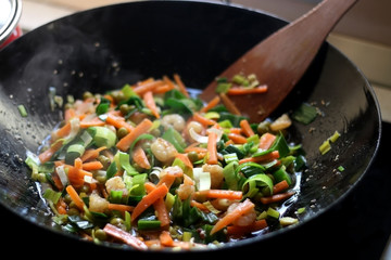 Cooking stir-fry vegetables and shrimps. Selective focus.