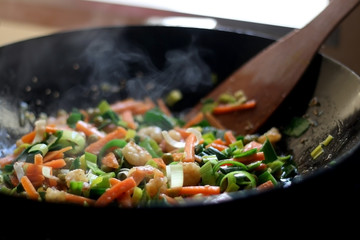 Cooking stir-fry vegetables and shrimps. Selective focus.