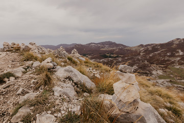 Fototapeta premium Panoramic view of the highest peaks of the Lovcen mountain national park in southwestern Montenegro. - Image.