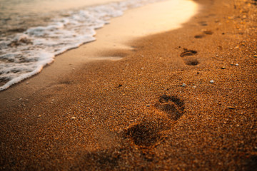 Footprints on wet sand