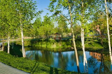 MOSCOW, RUSSIA - MAY 10, 2018: Brateevsky Park. Place of recreation and entertainment, a wooden gazebo by the pond