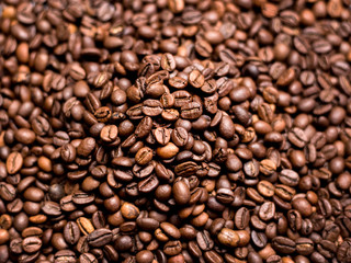 Obraz premium Coffee Background. roasted coffee beans, top view, Represent breakfast, energy, freshness or great aroma