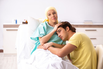 Fototapeta premium Husband looking after wife in hospital