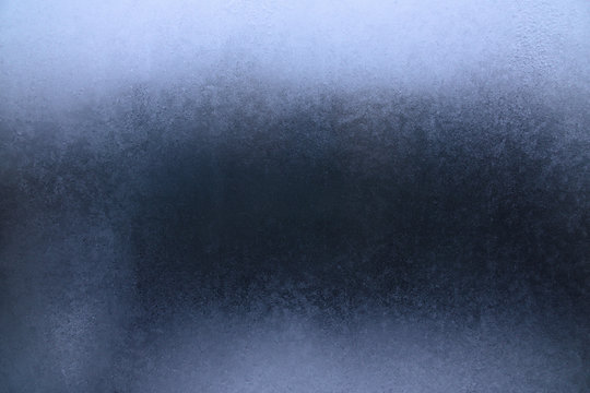 Dark textured frosted glass. Winter background
