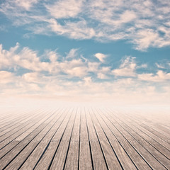 Fototapeta na wymiar pier in a cloudy blue sky on sunset