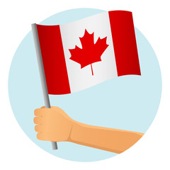 Fototapeta na wymiar Canada flag in hand