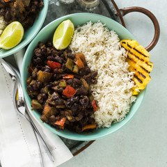 Cuban rice and black bean dish with grilled pineapple. Healthy Vegan Caribbean food for the whole family, party or restaurant menu
