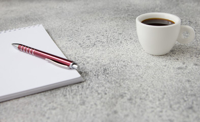 cup coffee paper pen concrete table Education business concept