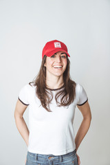 Happy beautiful woman with red hat in studio