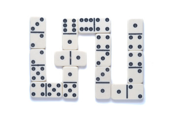 A row of domino stones on a light background