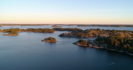 Close to frosty, first snowy islands, at sunset, at the Gulf of Finland, on a sunny, cold, fall evening, Varsinais-suomi, Suomi