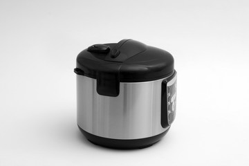 Modern electric multi cooker on light background