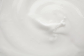 Delicious creamy yogurt as background, closeup view