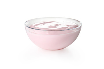 Glass bowl with creamy yogurt on white background