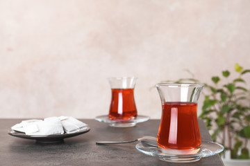 Traditional Turkish cup of tea on table. Space for text