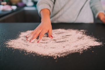 a person cooking minced meat in a beautiful kitchen
