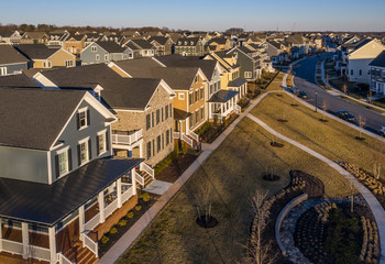 Fototapeta premium American new construction luxury colonial real estate single family homes in Maryland USA, with blue sky background