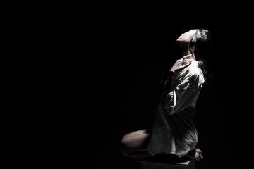 White Smoke Tan Skin Asian Woman black straight hair with Dense Fluffy Puffs of Fog on dark Background, Abstract high low exposure contrast, copy space for text logo, broken heart lonely girl can cry