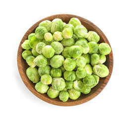 Bowl of fresh Brussels sprouts isolated on white, top view