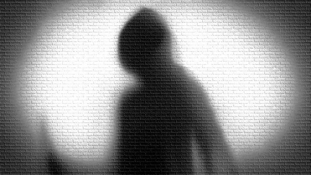 silhouette of a man in background