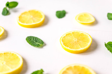 Lemon with mint on a white background. Healthy food products. Vitamin C. Beautiful lemon photo