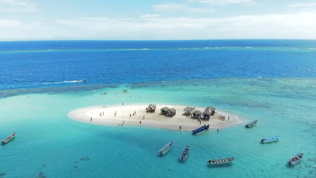 Aerial Descent: Picturesque Small Island with Motorboats 