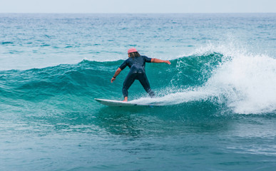 Man surfer on sea waves 