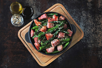 Green beans with bacon in a cast iron skillet. Healthy eating concept. Keto diet. Pegan diet. Paleo diet.