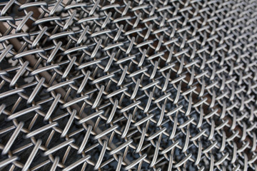 Metal chain fence seamless texture background texture. Abstract background of steel chain fences. Woven silver metal mesh. Industrial Strength or power concept background image. Metal or steel pattern