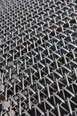 Metal chain fence seamless texture background texture. Abstract background of steel chain fences. Woven silver metal mesh. Industrial Strength or power concept background image. Metal or steel pattern