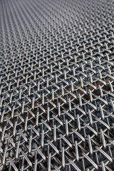 Metal chain fence seamless texture background texture. Abstract background of steel chain fences. Woven silver metal mesh. Industrial Strength or power concept background image. Metal or steel pattern