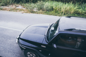 Front of a car moving on the road to Cusco - Peru