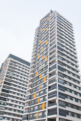 New multi-storey residential building apartment houses. Mortgage and construction background concept image.