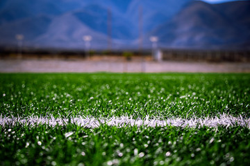 Football field with a mountainous background