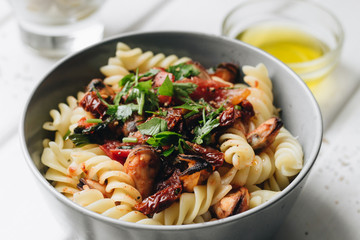 Delicious pasta with tomatoes, mussels and herbs