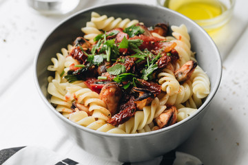 Delicious pasta with tomatoes, mussels and herbs	
