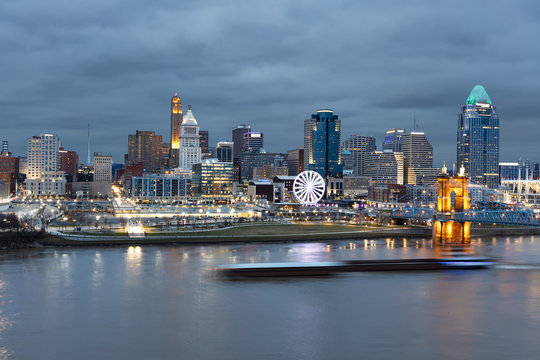 View of Cincinnati Skyline with a Barge Zipping Through the Ohio River