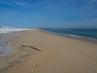 Empty beach after snowfall