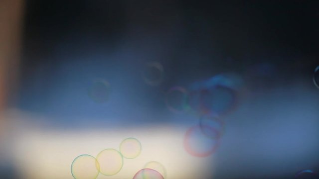 Soap bubbles flying fast in the wind, abstract background