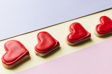 Cookies in heart shape with red glaze , valentines day celebration 